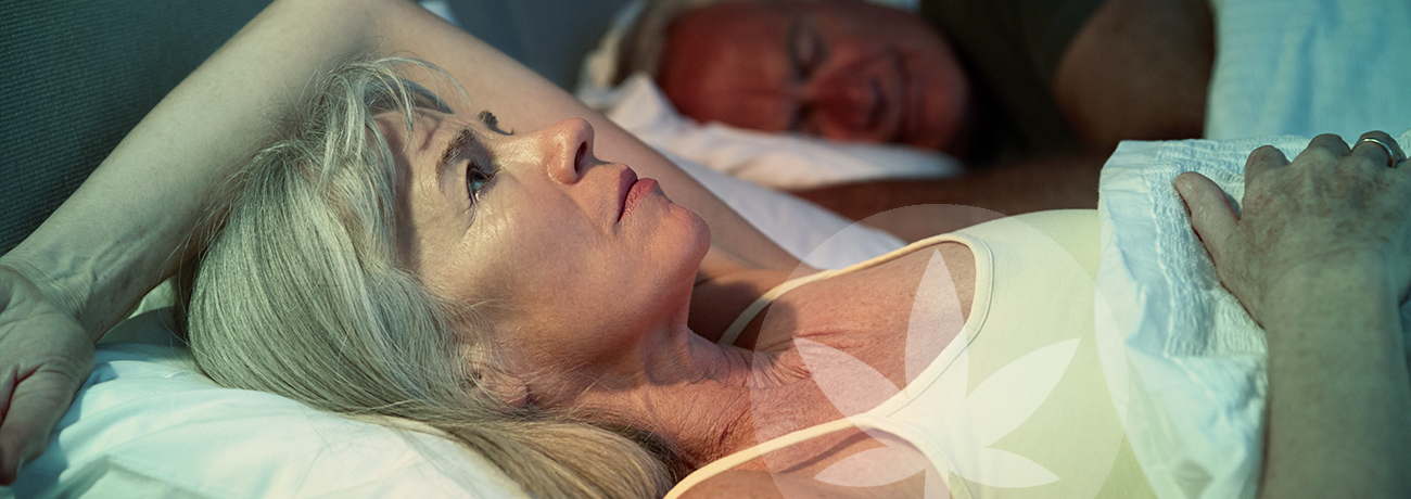 Woman laying in bed awake